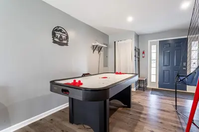 a ping pong table in a living room with at My Blue Haven Game Area 4 BDR Pet Friendly in Albrightsville