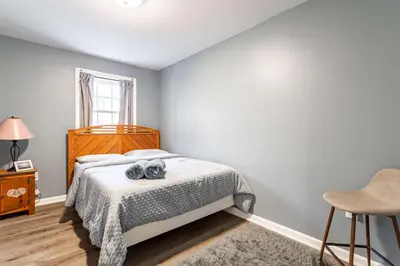 a bedroom with a bed with a stuffed animal on it at My Blue Haven Game Area 4 BDR Pet Friendly in Albrightsville