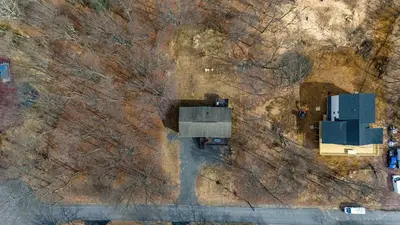 an overhead view of a building on a hill with trees at My Blue Haven Game Area 4 BDR Pet Friendly in Albrightsville