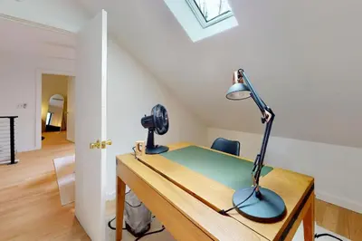 a desk with a camera and a lamp on it at Sage Grove Sanctuary 3BD Hot Tub Fire Pit in East Stroudsburg