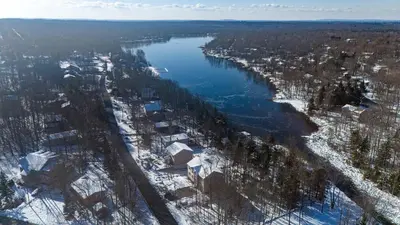an aerial view of a river with snow on the ground at Lakeside Haven 5 BDR Fire Pit Pet Friendly in Tobyhanna