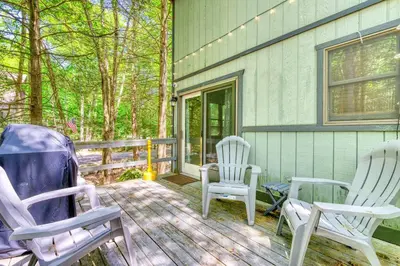 two rocking chairs sitting on a porch of a house at 4BDR Hot Tub Game Room in Lake Ariel
