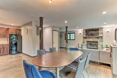 a dining room and kitchen with a table and chairs at Hot Tub Secluded Fire Pit Hammock in Stroudsburg