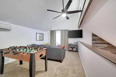 a living room with a chess board on a table at Cozy 3 BR Game Area Fire Pit in East Stroudsburg