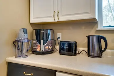 a kitchen counter with appliances on a counter top at Serenity Grove Game Room Fire Pit Dog Friend in Pocono Pines