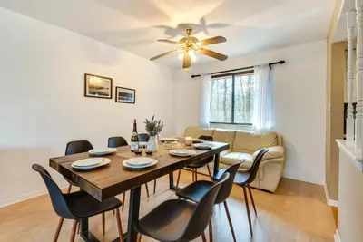 a dining room with a table and chairs at Serenity Grove Game Room Fire Pit Dog Friend in Pocono Pines