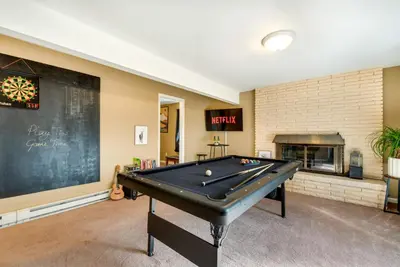 a pool table in a room with a chalkboard at Serenity Grove Game Room Fire Pit Dog Friend in Pocono Pines
