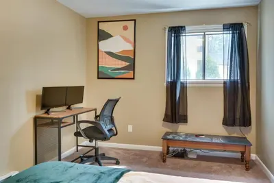 a bedroom with a desk and a computer and a chair at Serenity Grove Game Room Fire Pit Dog Friend in Pocono Pines