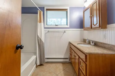 a bathroom with a sink and a tub and a window at Whispering Pines Chalet Game Room Fire Pit in Pocono Pines