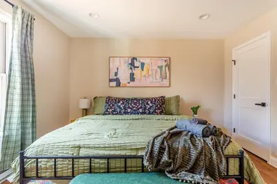 a bedroom with a bed and a window at The Buckhorn Chalet Hot Tub Arcades 6 Bedroom Fire Place in Albrightsville