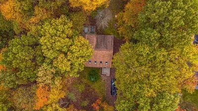 an aerial view of a house in the trees at Blue Wolf Retreat Pool Table Cozy BBQ in Albrightsville