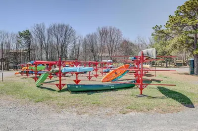 a row of colorful play structures in a park at Blue Wolf Retreat Pool Table Cozy BBQ in Albrightsville