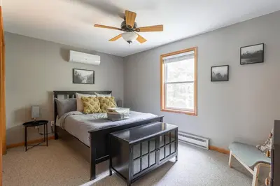 a bedroom with a bed and a ceiling fan at Game Area Open Concept 4 BDR in Albrightsville