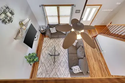 an overhead view of a living room with a ceiling fan at Cedar Cove Retreat Pool BBQ Game Room in Albrightsville