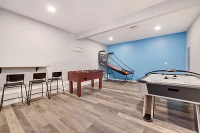 a room with a pool table and a slide at Cedar Cove Retreat Pool BBQ Game Room in Albrightsville