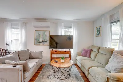 a living room with two couches and a table at Walkable Dtwn Townhome Near Campus and Palmer Square in Princeton