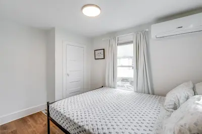 a bedroom with a bed and a window at Walkable Dtwn Townhome Near Campus and Palmer Square in Princeton