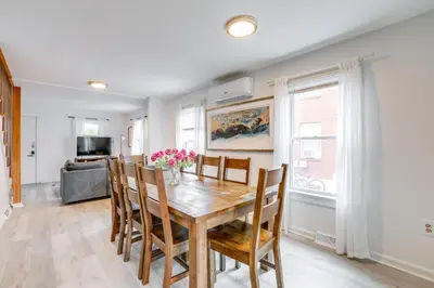 a dining room with a wooden table and chairs at Walk to Campus and Palmer Square Dtwn Townhome in Princeton