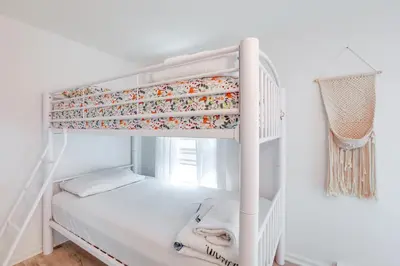 a white bunk bed in a white room at Walk to Campus and Palmer Square Dtwn Townhome in Princeton
