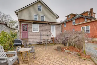 a house with a patio with chairs and a table at Walk to Campus and Palmer Square Dtwn Townhome in Princeton