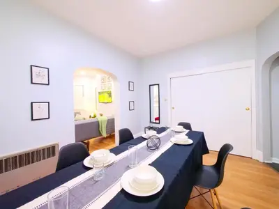 a meeting room with a long table and chairs at NYC Views & Comfort - Modern 2-Bedroom Apartment in Jersey City
