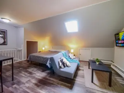 a bedroom with a bed with two stuffed animals on it at Cozy Jersey City Apt near NYC Free Wi-Fi & Great Location in Jersey City