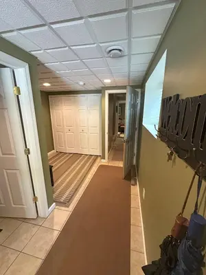 a hallway of a house with doors and a ceiling at Wallenpaupack Lake house in Greentown