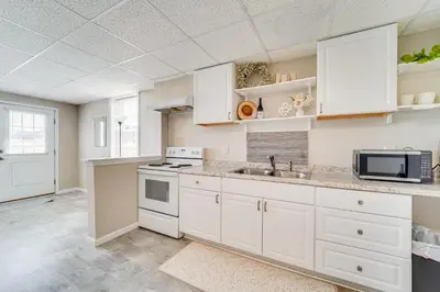 a kitchen with white cabinets and a sink at Mtn-View Studio 18 Mi to Penn State! in Spring Mills
