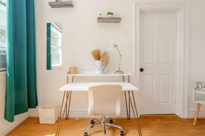 a white desk with a chair in a room at 6-Guest Jersey City Haven: Location-Comfort-Vibes in Jersey City