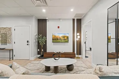 a living room with a couch and a table at Apartmint at The Metropolitan - Philadelphia in Philadelphia