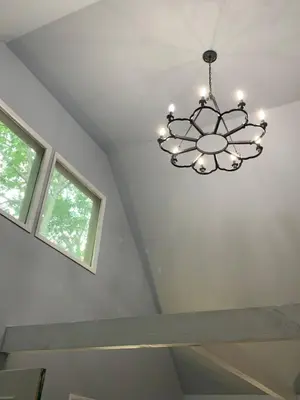 a chandelier hanging from a ceiling in a room at Fully updated home with hot tub in amenity filled community in Lackawaxen
