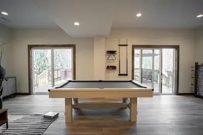 a pool table in the middle of a room at Luxury Chalet with hot tub in scenic Poconos in Albrightsville