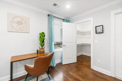 a home office with a desk and a chair at Orange's Oasis in East Orange