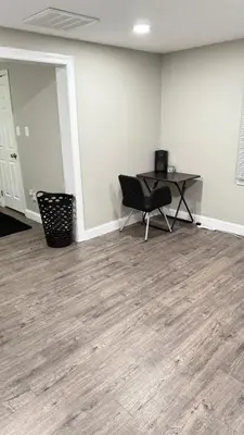 an empty office with a desk and a chair in a room at Rooms available in a single Family home shared with Host in Willingboro