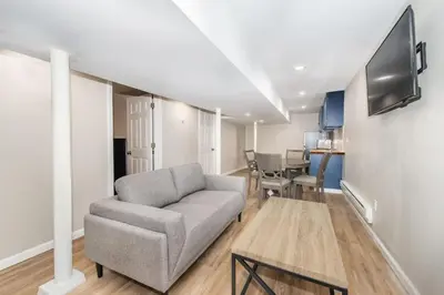 a living room with a couch and a table at Cozy Basement 2 Bed in Passaic in Passaic