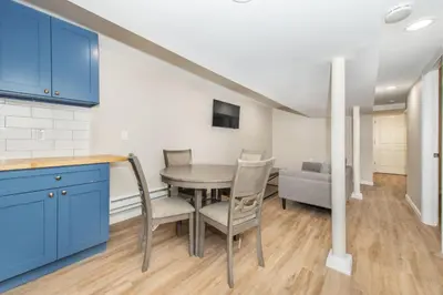 a kitchen and dining room with a table and chairs at Cozy Basement 2 Bed in Passaic in Passaic