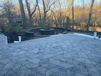 a stone patio with a fire pit in a park at RiverFront Villa- Sleeps 11 in Lancaster