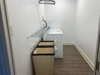 a kitchen with a sink and a washing machine at RiverFront Villa- Sleeps 11 in Lancaster
