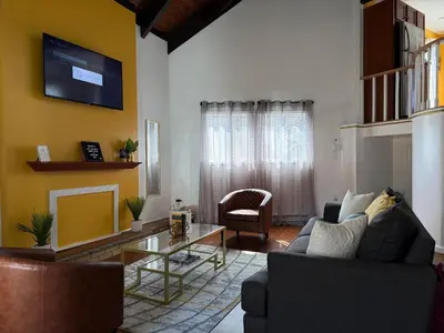 a living room with a couch and a table at Cozy Pocono Escape in Tobyhanna