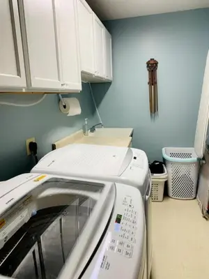 a kitchen with a sink and a washing machine at Lake Cabin with Hot-Tub and Deck in Pennsylvania in Lake Ariel