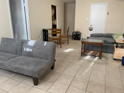 a living room with a couch and a table at New Jersey Apt 1 bd in Edison