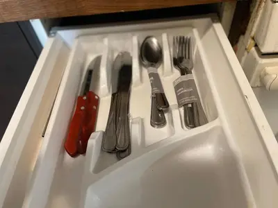 a white tray with utensils on top at New Jersey Apt 1 bd in Edison