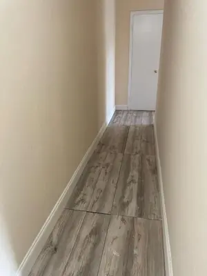 an empty room with a wooden floor and a door at New Jersey Apt 1 bd in Edison