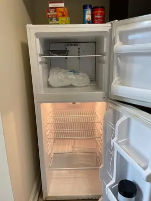 an open refrigerator with its door open and itsartmentsearch at New Jersey Apt 1 bd in Edison