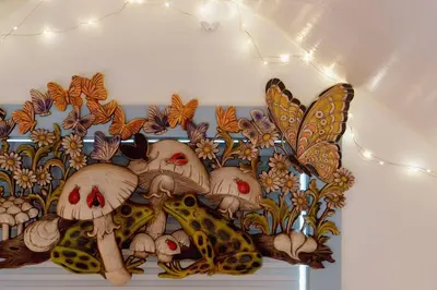 a painting of butterflies and mushrooms on a wall at Alice in Wonderland Pocono Home in Honesdale
