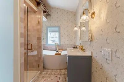 a bathroom with a tub and a sink and a shower at Alice in Wonderland Pocono Home in Honesdale