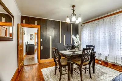 a dining room with a table and chairs at 2 Mi to Dtwn Harrisburg Escape with Furnished Deck! in Harrisburg