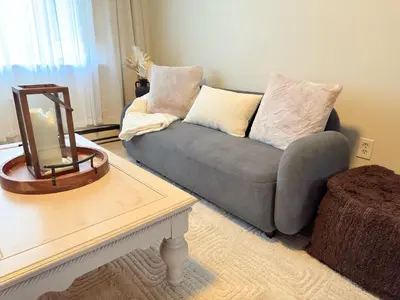 a living room with a couch and a table at Independence Day Best Fireworks View July 6 in Clifton