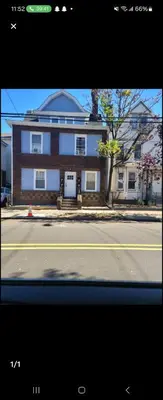 a house on the side of a street at Rose room 8 in Newark