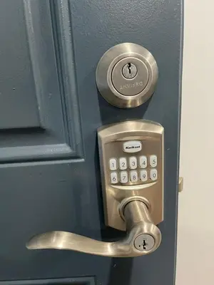 a metal doorhandle with a lock on a door at Beautiful Room 10D in Newark